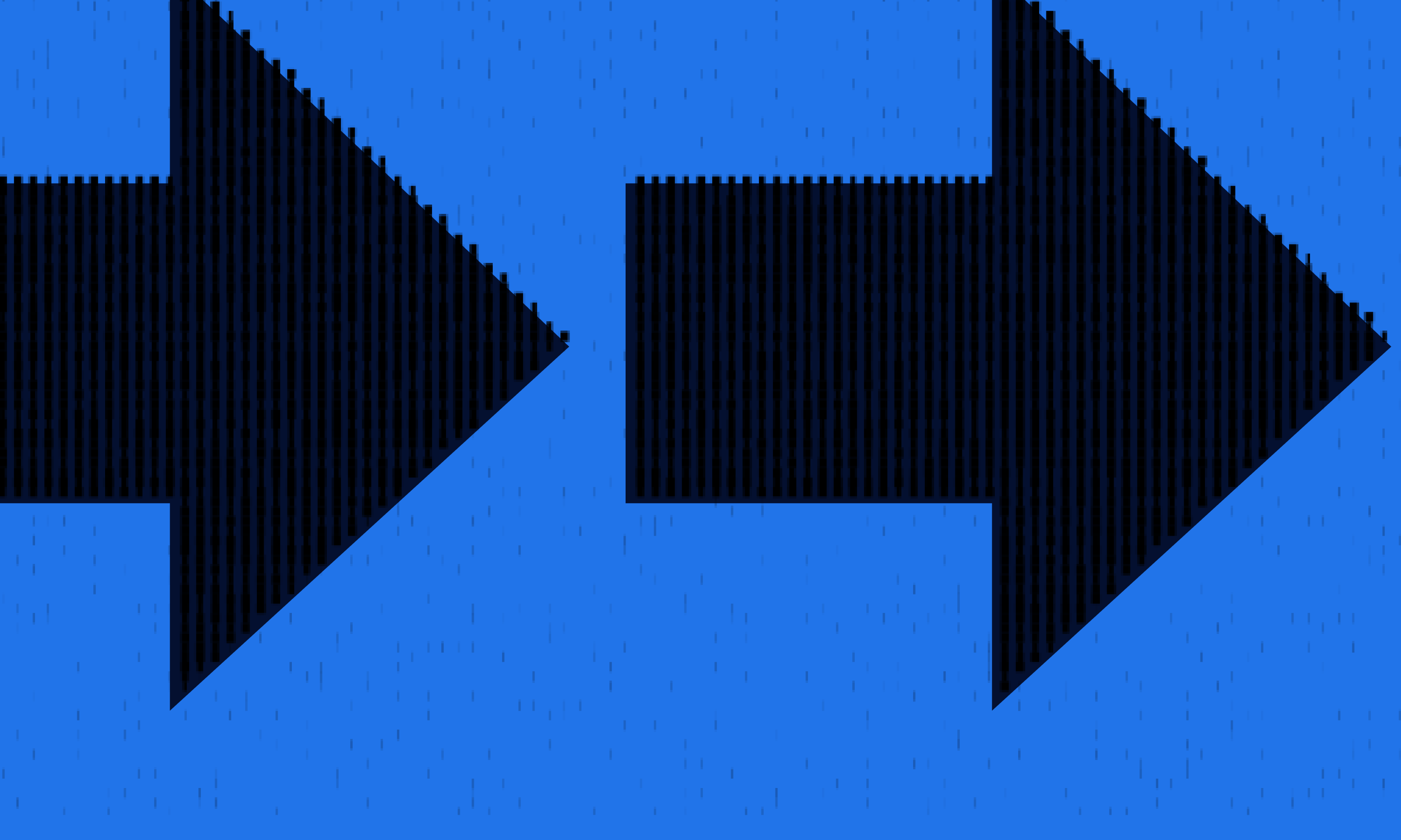 Two women sitting at a modern table talking with a city view behind them.